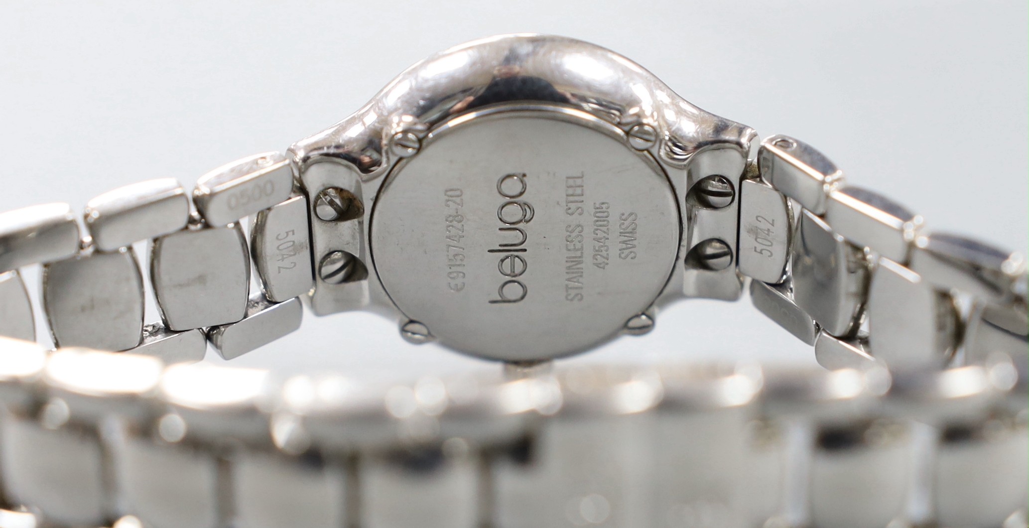A lady's modern stainless steel Ebel quartz wrist watch and bracelet with diamond set dial and bezel, with box and papers.